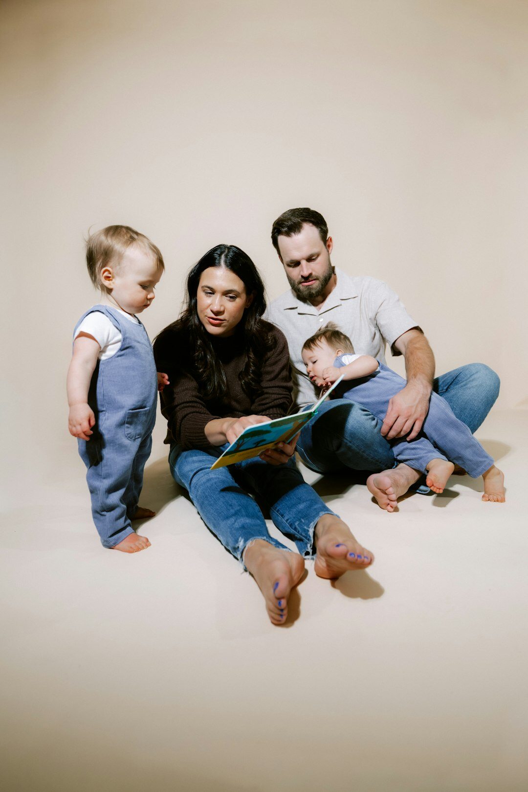 Turkish family sitting together reviewing paperwork at home